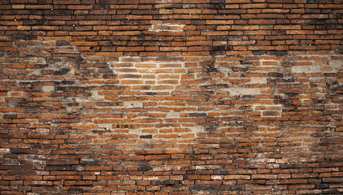 Old brick wall surface detail of temple thai ancient times in thailand