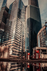 Low angle view of modern buildings against sky in city