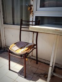 Abandoned chair and table at home