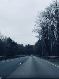 Road seen through windshield of car