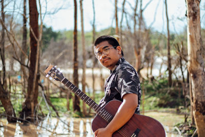 Portrait of a man playing guitar