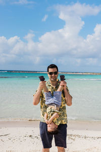 Father and son on a beach