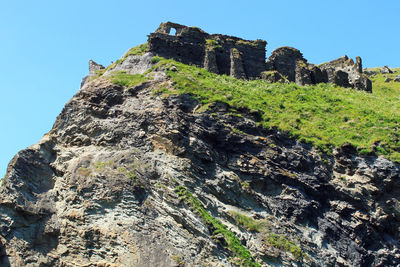 Low angle view of old ruins against sky