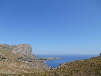 Scenic view of sea against clear blue sky