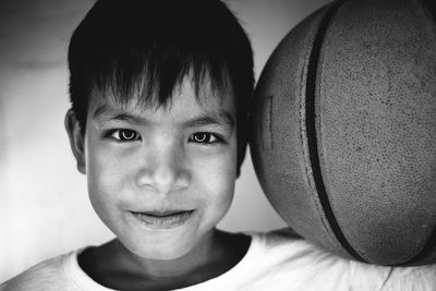 Portrait of boy with basketball