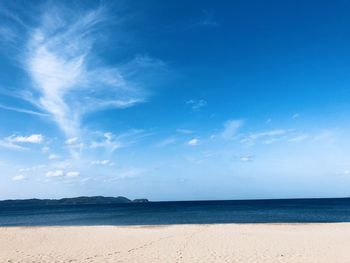 Scenic view of sea against blue sky