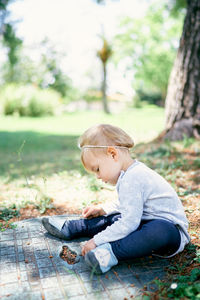 Side view of girl playing outdoors