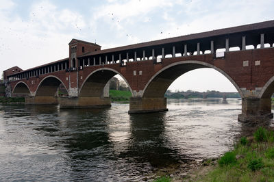 Bridge over river against sky