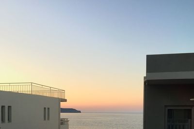 Scenic view of sea against clear sky during sunset