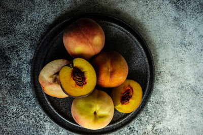 Ripe and healthy peach fruits in the bowl