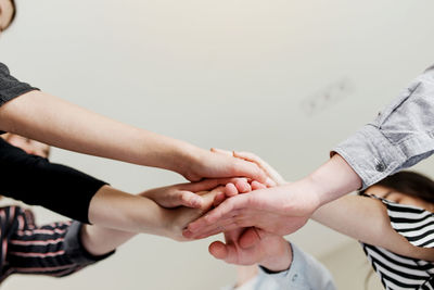 Midsection of couple holding hands