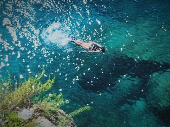 Man swimming in sea