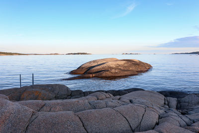 Rocks on shore against sky