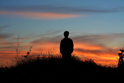 Silhouette of man at sunset