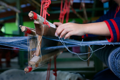 Close-up of hand holding cigarette