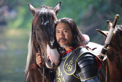 Man in warrior costume with horse