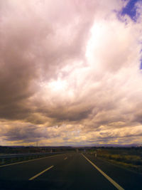 Highway against dramatic sky