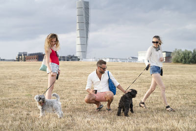 Family walking with dogs