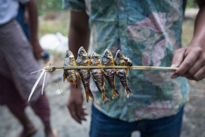 Small river fish caught and baked on open fire