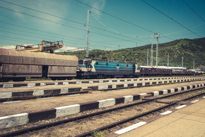 Train on railroad track against sky