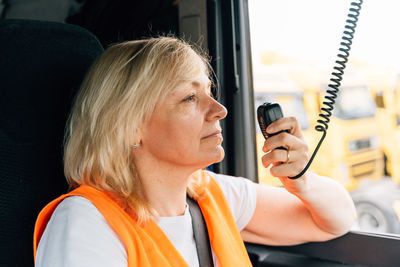 Mature woman talking on cb radio