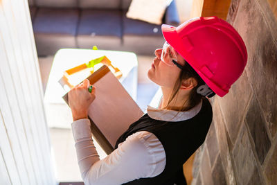 High angle view of engineer examining at construction site