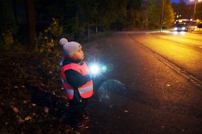 Full length of child on road at night