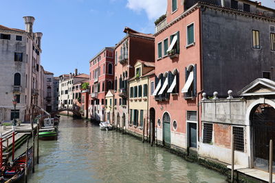 Canal amidst buildings in city