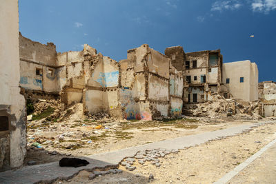 Abandoned buildings against sky