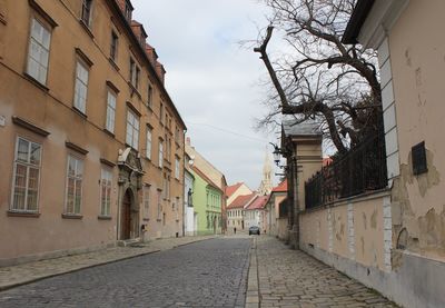 Street amidst residential buildings