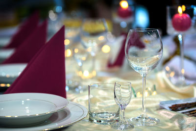 Close-up of wine glasses on table in restaurant