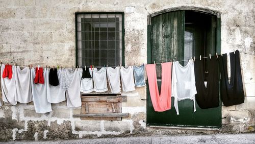 Clothes drying against wall of buildings, matera, italy