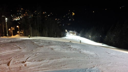 Snow covered landscape at night