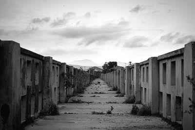 Narrow walkway leading to building