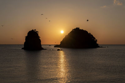 Scenic view of sea against sky during sunset