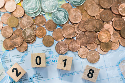 High angle view of coins on table