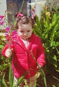 Close-up of cute girl with pink flowers