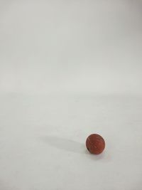 Close-up of strawberry over white background