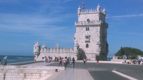 Tourists against clear sky