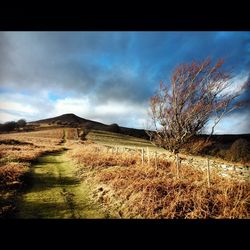 Scenic view of landscape against cloudy sky