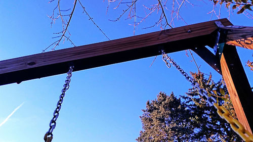 Low angle view of built structure against clear blue sky