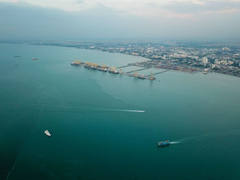 High angle view of cityscape by sea