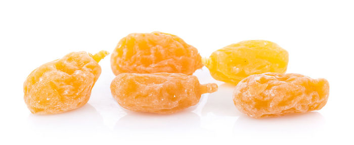 Close-up of orange fruits against white background