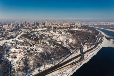 Beautiful winter top view of the kiev-pechersk lavra. many churches in the snow.