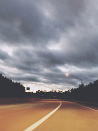 View of road against cloudy sky