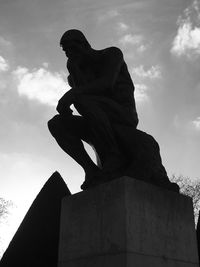 Low angle view of statue against cloudy sky