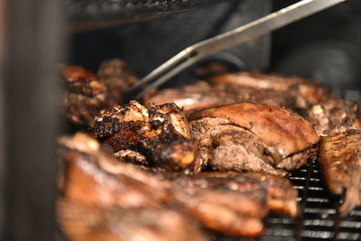 Close-up of meat on barbecue grill