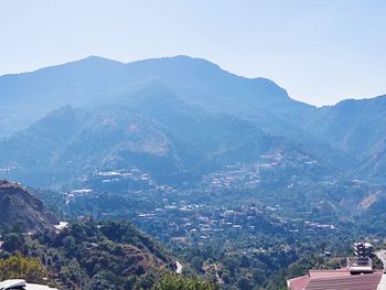 High angle view of townscape and mountains against sky