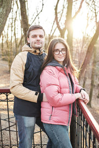 Young loving couple enjoy the sun and warm stroll in the spring park