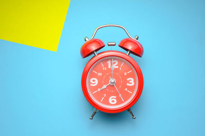 Close-up of clock against blue background